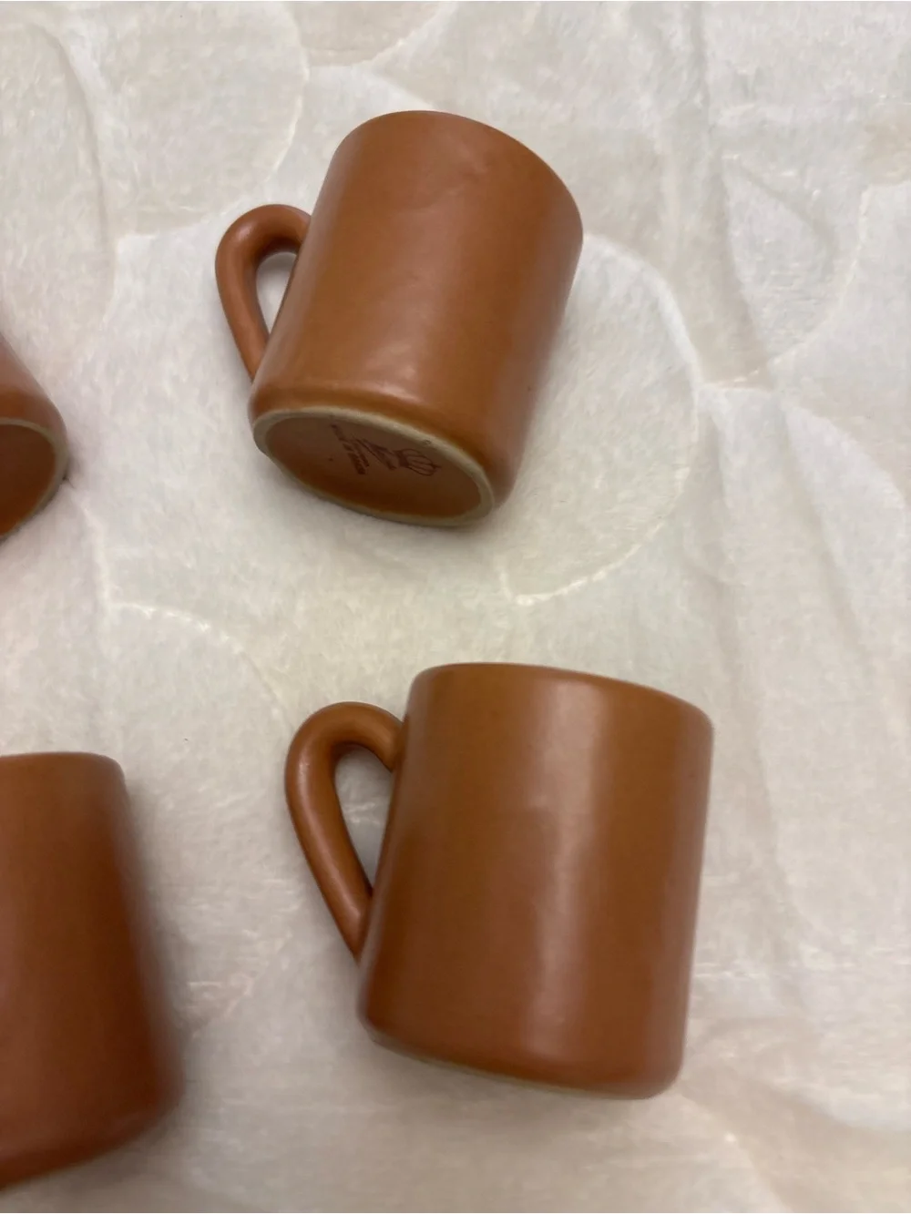 Four brown stoneware pottery expresso shot coffee mugs